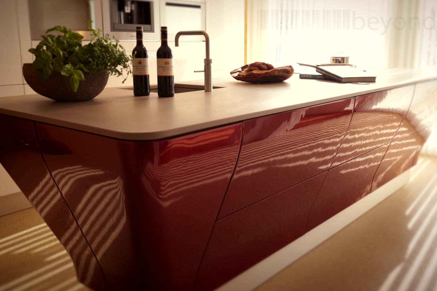 Beyond custom kitchen with a curved high-gloss red island