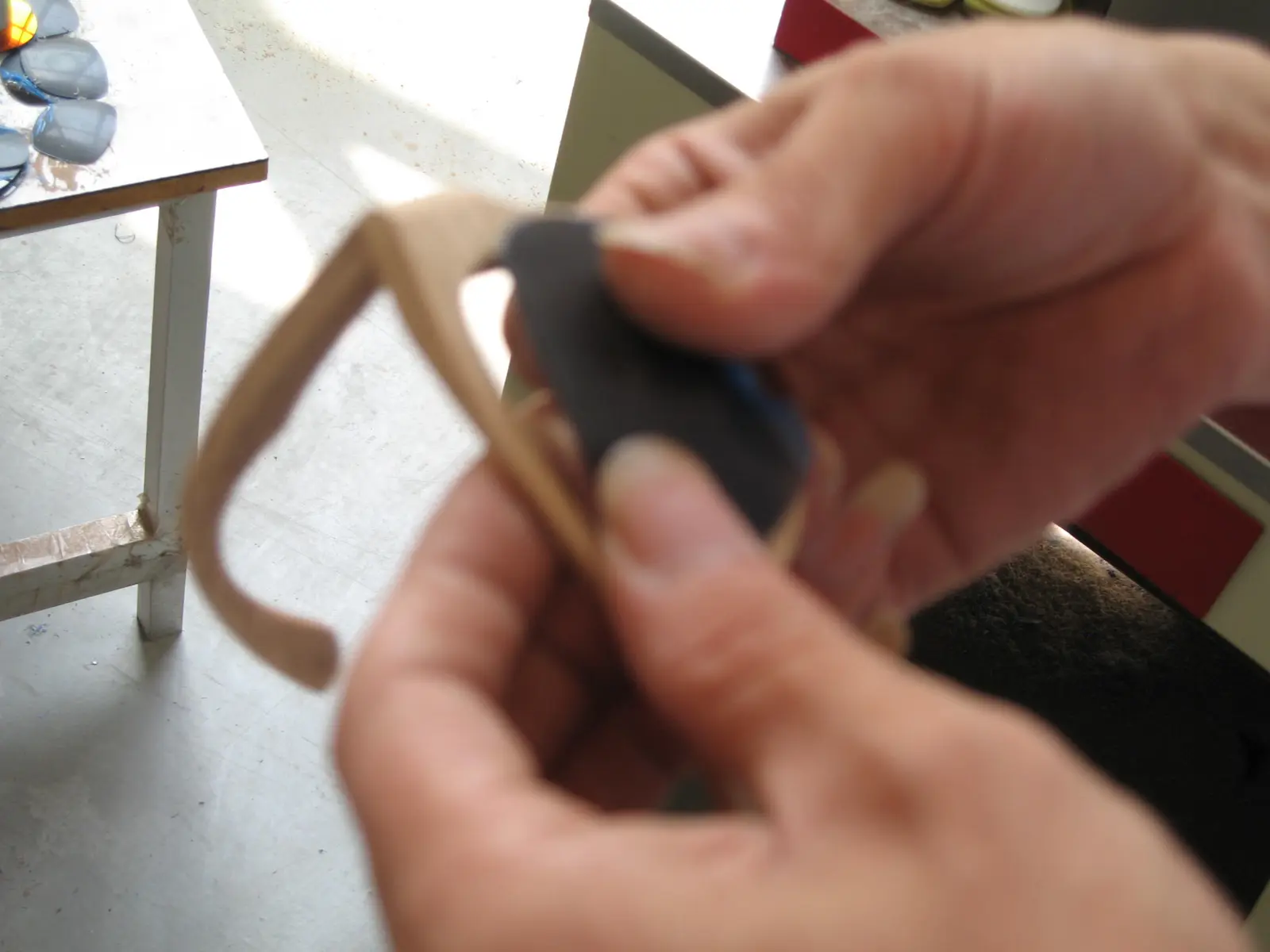 Hand finishing a wooden BRIL frame